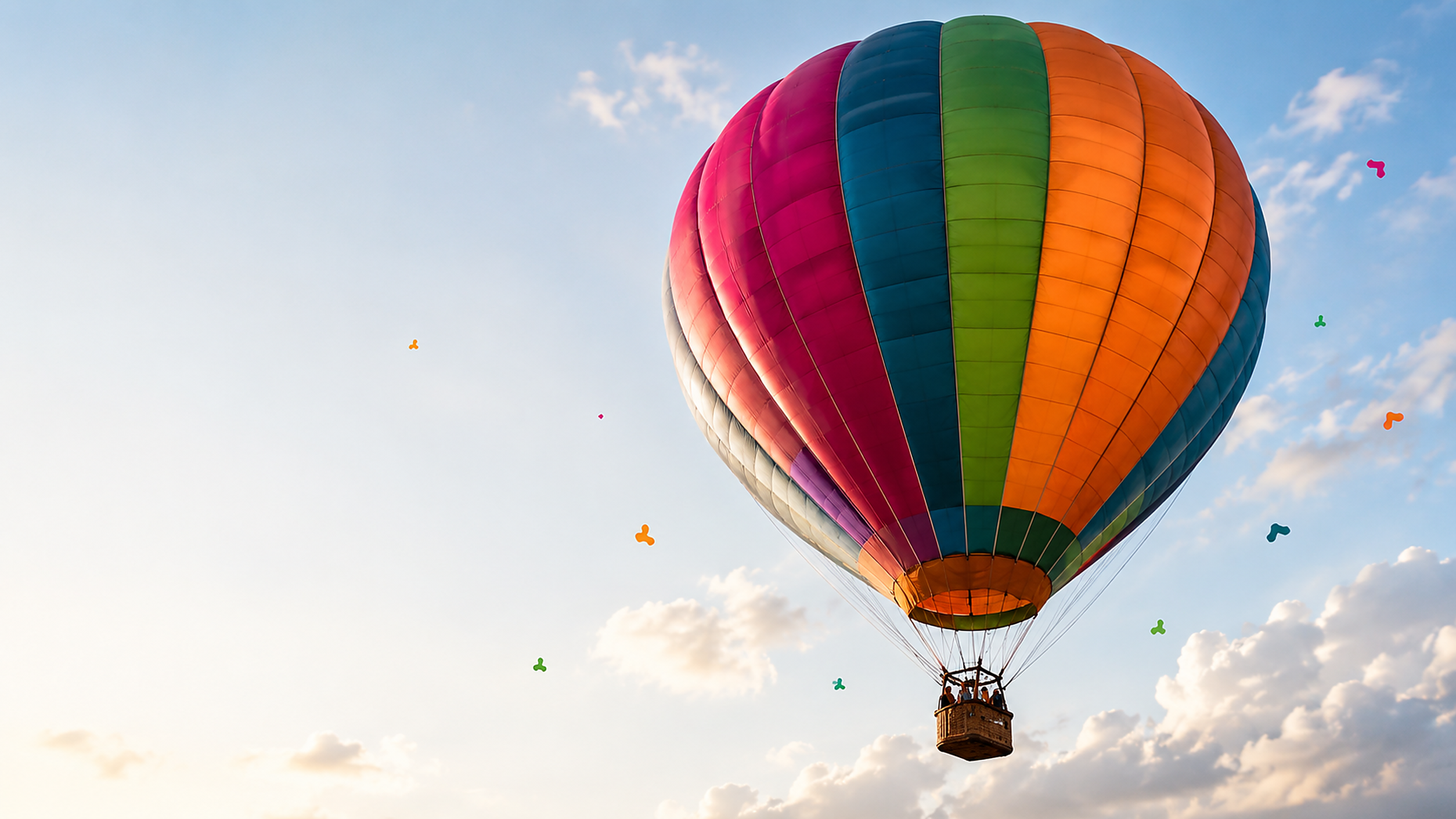 Globo aerostático multicolor, símbolo de Grupo UP